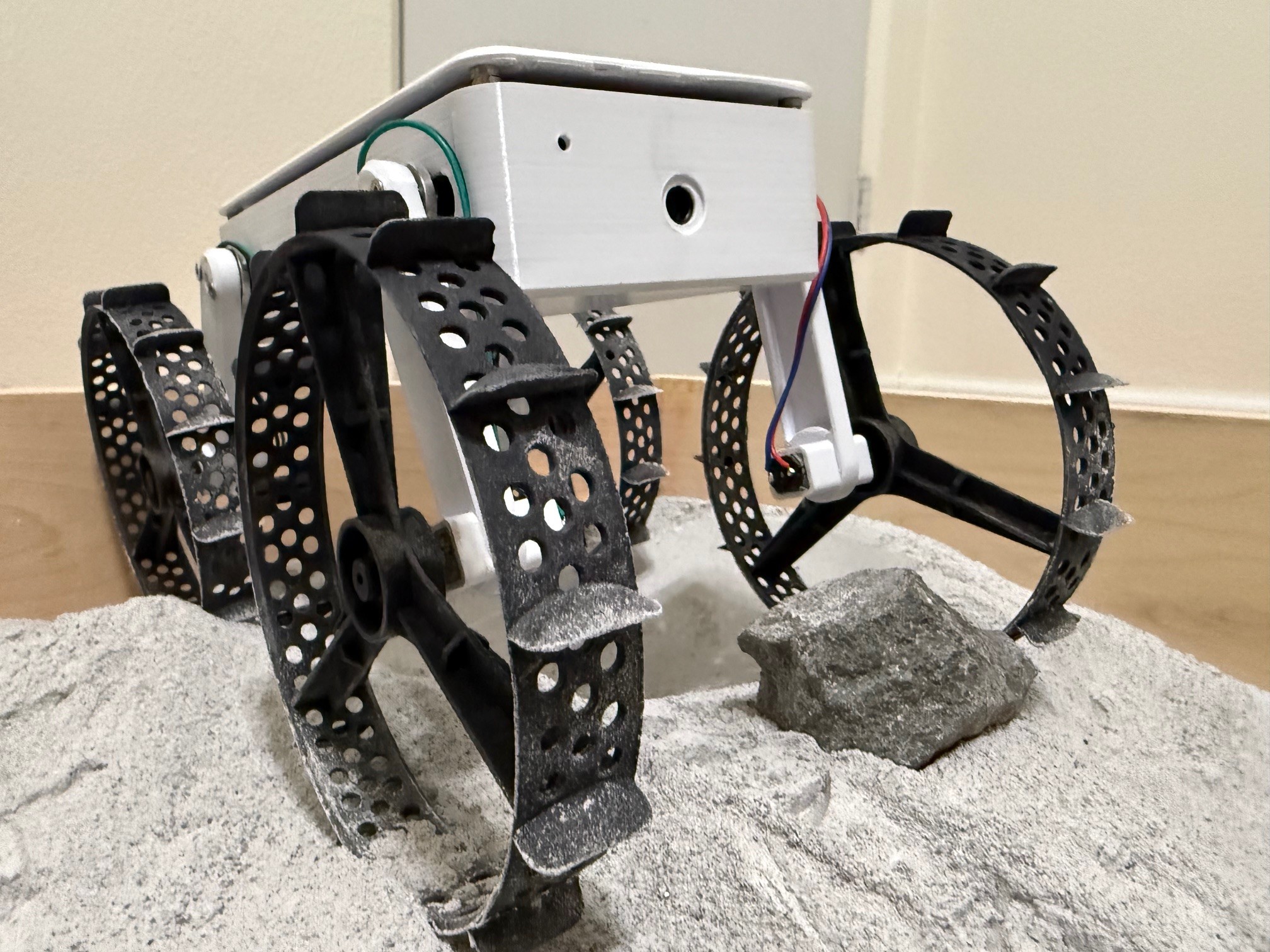 ATHENA lunar micro-rover prototype traversing regolith test terrain